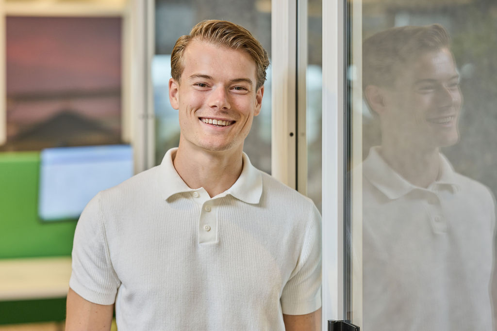 young sitting behind desk