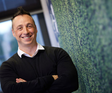 man leaning against a wall