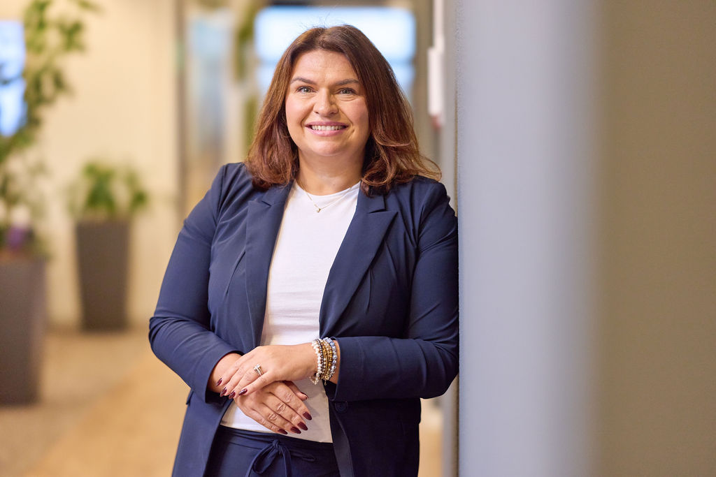 Woman standing against a wall 
